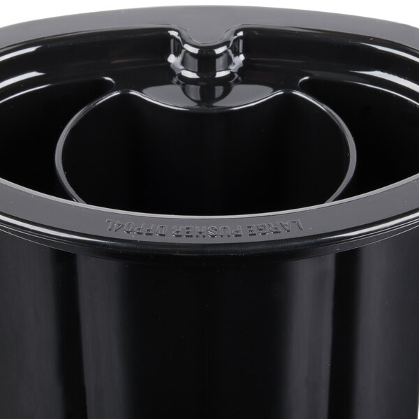 A black container with a lid and a hole in the middle.