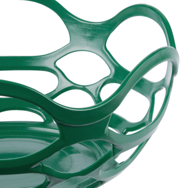 a green plastic basket with holes
