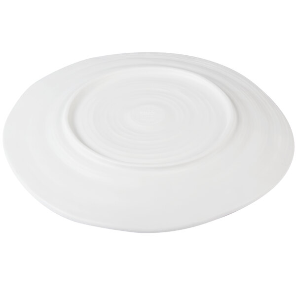 An off white Elite Global Solutions Della Terra melamine plate with a circular pattern.