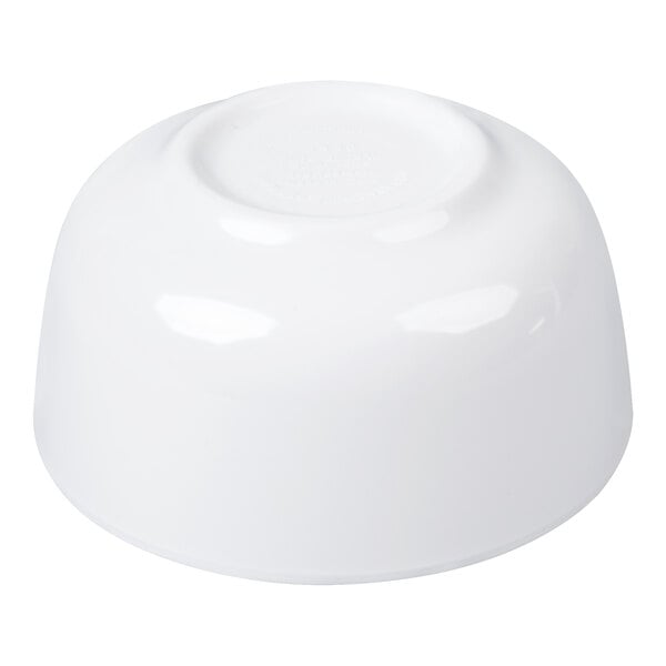 A white round melamine bowl shown upside down.