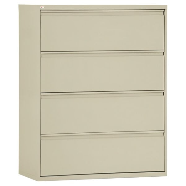 A beige metal file cabinet with four drawers.