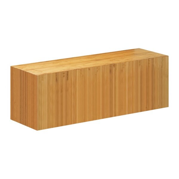 A rectangular wooden Cal-Mil plate riser.