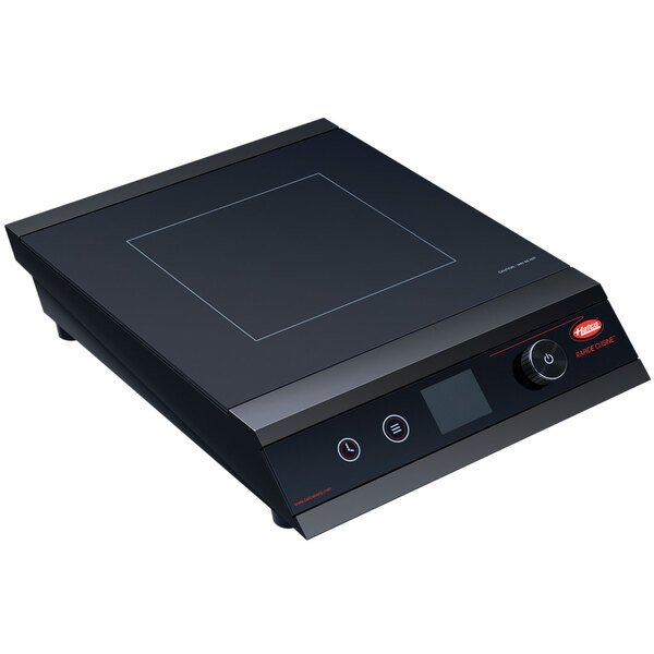 A black Hatco Rapide Cuisine countertop induction cooker with a square electronic device with a red button.