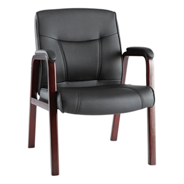 A black leather chair with wooden legs.