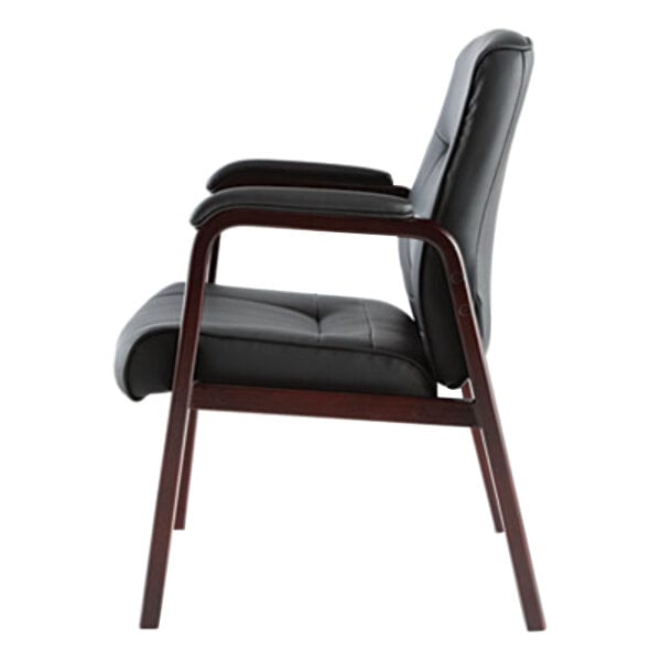 A black leather Alera Madaris arm chair with wooden legs.