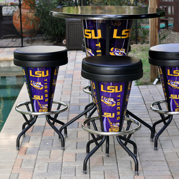 A round metal table with a Louisiana State University LED bar stool and a purple and yellow bucket on it.