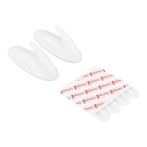 A set of two white medium designer hooks with adhesive strips.