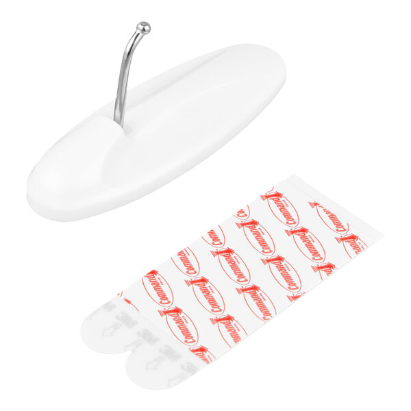 A white large wire hook with an adhesive strip for wall mounting.