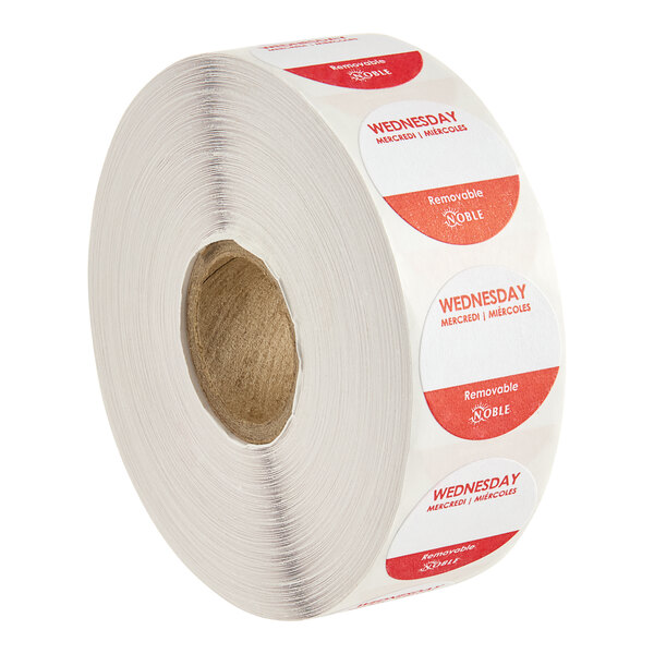 A roll of white Noble Products day of the week stickers with red circles.
