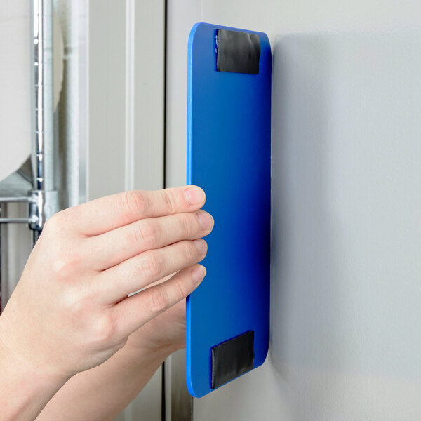 a person holding a blue object