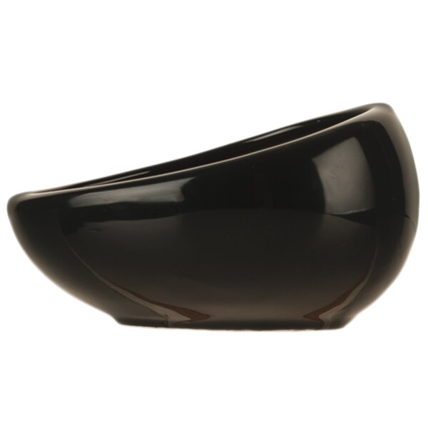 A close-up of a black World Tableware Pebblebrook Tiger Porcelain Dip Dish.