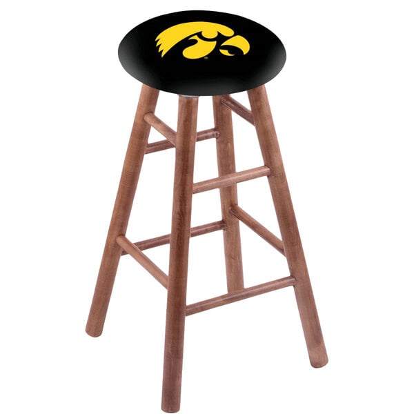 A wooden Holland Bar Stool with a University of Iowa logo on the seat.