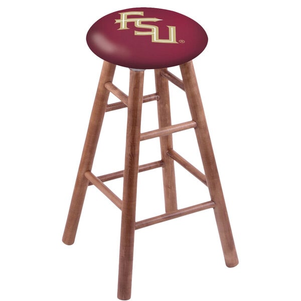 A Holland Bar Stool Florida State University bar stool with a medium finish and a logo on the seat.