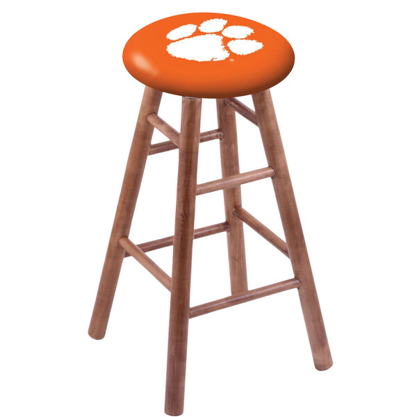 A Holland Bar Stool with a Clemson University paw print seat.