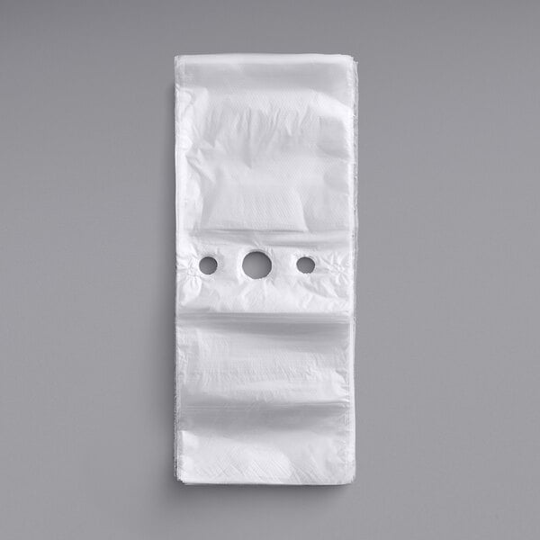 A white plastic deli saddle bag with a hole in it.