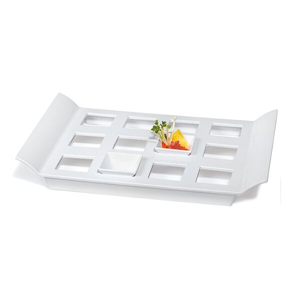 A white GET Melamine display tray with square slots.