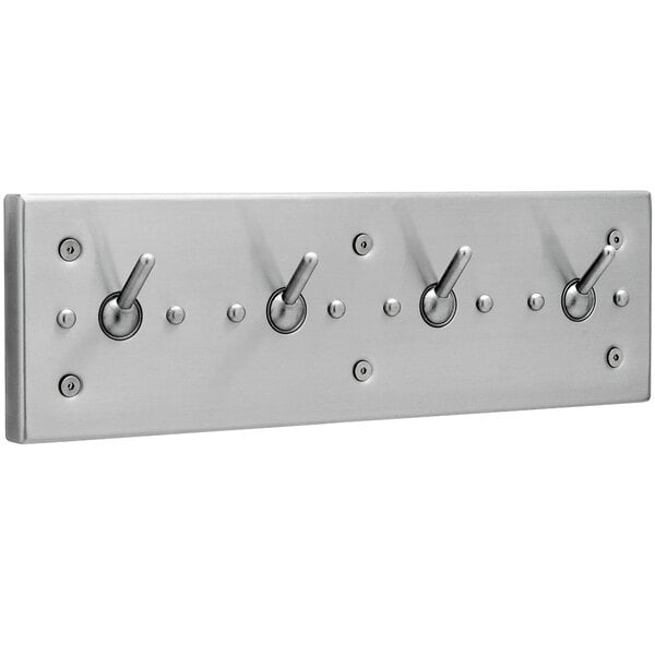 A silver stainless steel Bobrick clothes hook strip with four hooks.