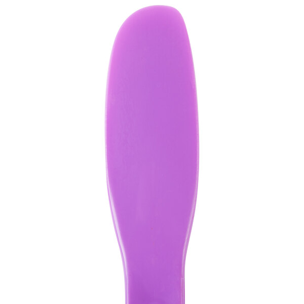 A purple plastic sandwich spreader with a white background.