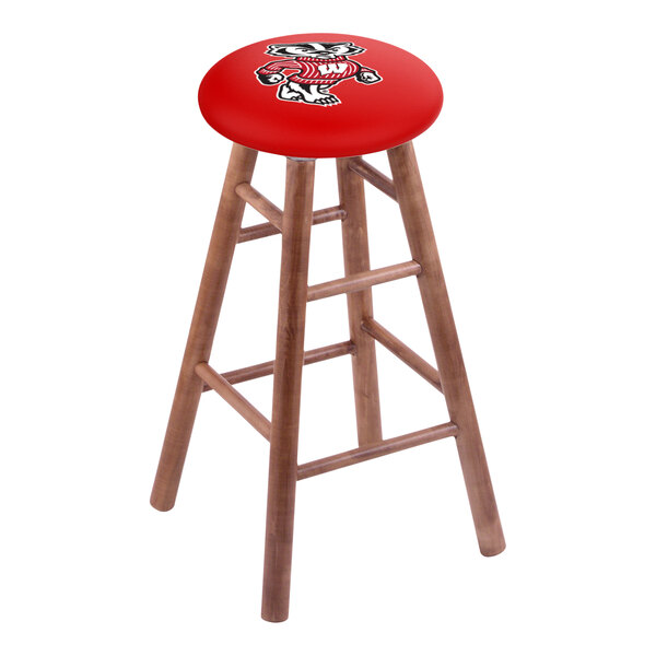 A wooden bar stool with a red seat featuring the University of Wisconsin mascot logo.