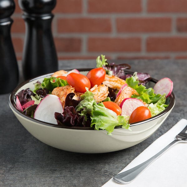 A round crackle bowl filled with salad with vegetables and meat.