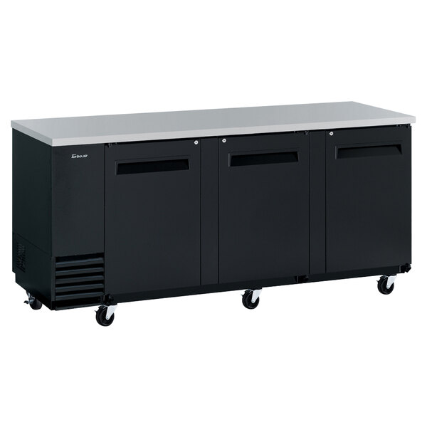 A black Turbo Air back bar refrigerator with three solid doors.