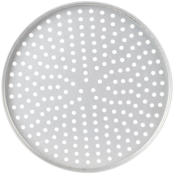 A white circular metal plate with holes.