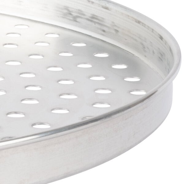 An American Metalcraft tin-plated steel pizza pan with perforations.