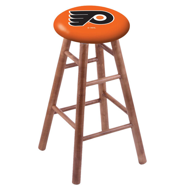 A Holland Bar Stool Philadelphia Flyers bar stool with a medium finish and a logo on the seat.