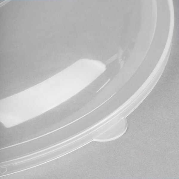A clear plastic Fineline catering bowl lid over a clear plastic bowl.