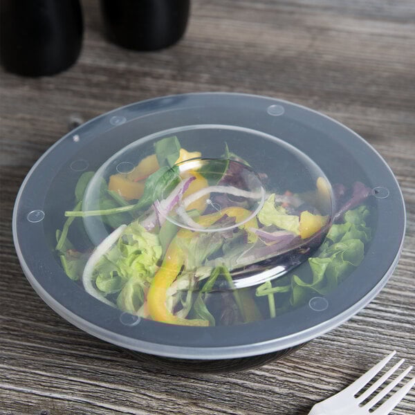 A salad in a Fineline black low profile plastic serving bowl.