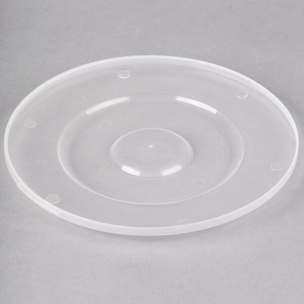 A clear plastic lid with a round bottom.