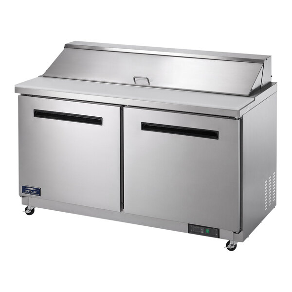 A stainless steel Arctic Air 2 door sandwich prep table on wheels.
