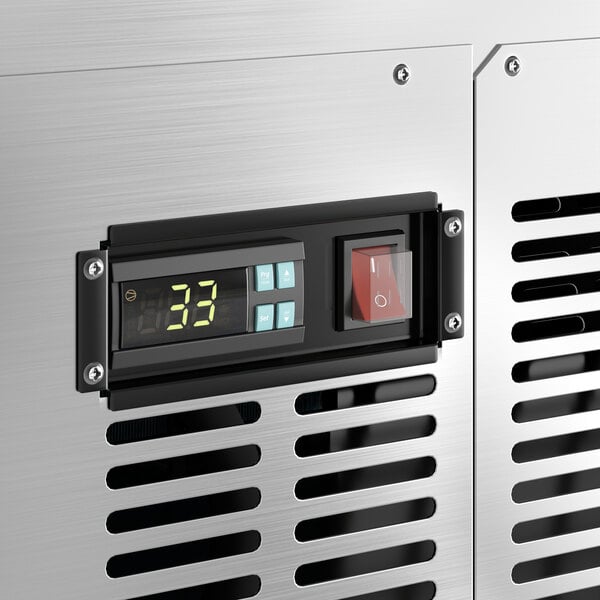 A close-up of the digital display on a stainless steel Avantco deli case.