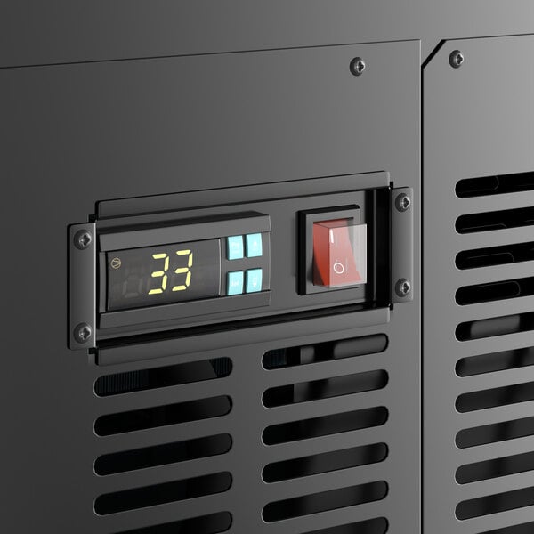 A close-up of the digital display and switches on a black Avantco refrigerated deli case.