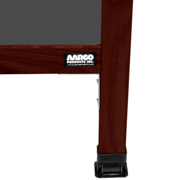 A cherry wood A-frame sign board with a slate gray chalkboard.