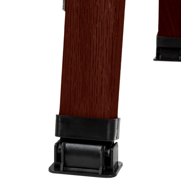 An Aarco cherry wood A-Frame sign board with a slate gray chalkboard surface.