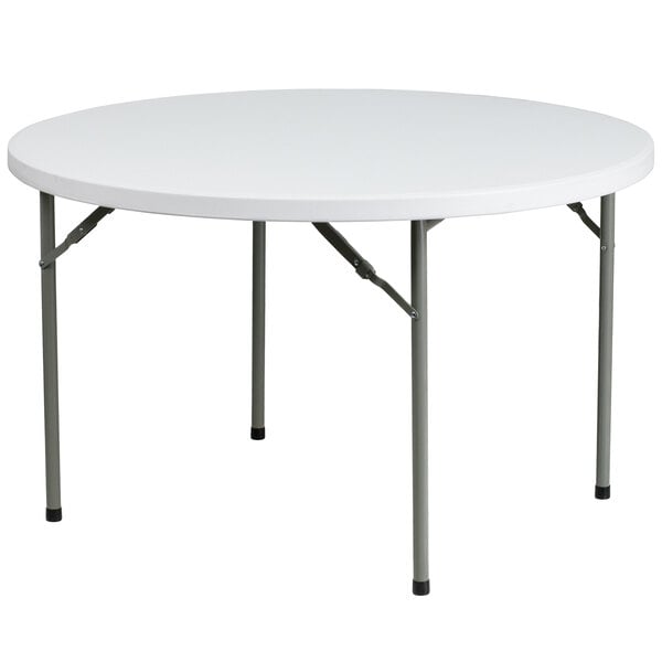 A Flash Furniture white round folding table with metal legs.