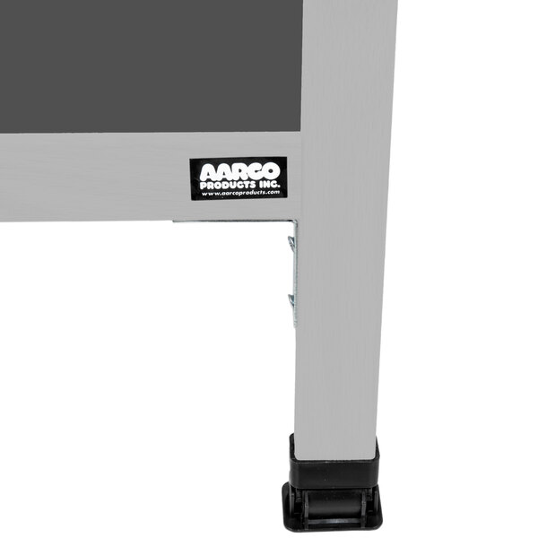 A close-up of the metal frame of an Aarco A-Frame Sign Board with slate gray porcelain chalk board inserts.