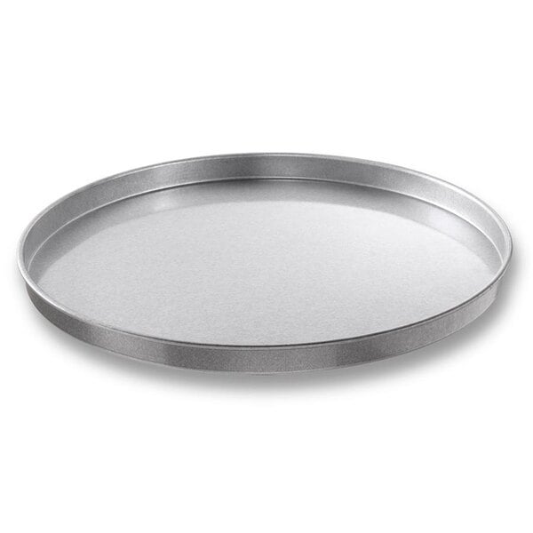 a round metal tray with a white background