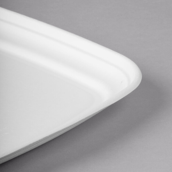 A white square compostable sugarcane tray with a curved edge.
