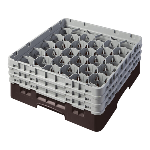 A brown plastic Cambro glass rack with many compartments.