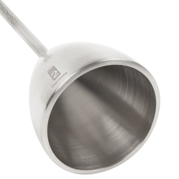 A close-up of a silver metal cylinder with a Matfer Bourgeat logo and a handle.