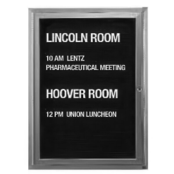 An Aarco enclosed message center with a black letter board displaying white text that says "Lincoln Room"