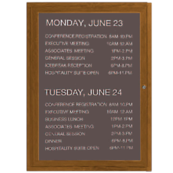 a brown board with white text