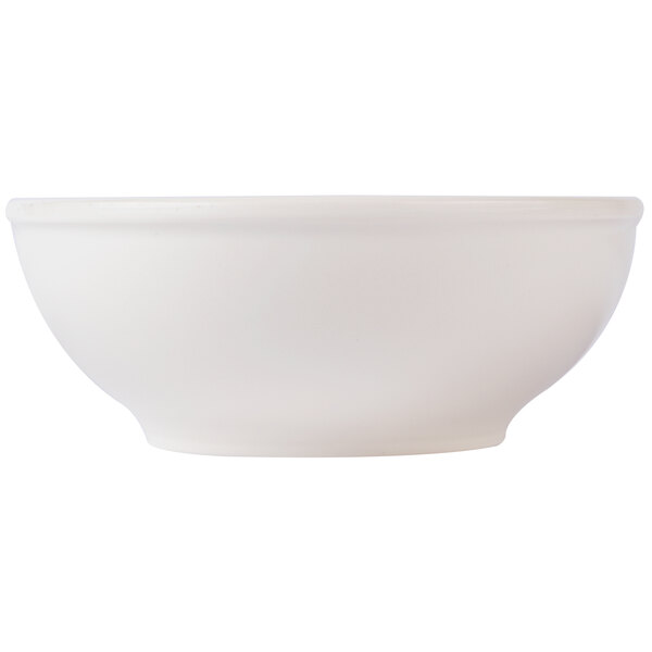 A close-up of a white Thunder Group melamine pho noodle bowl.