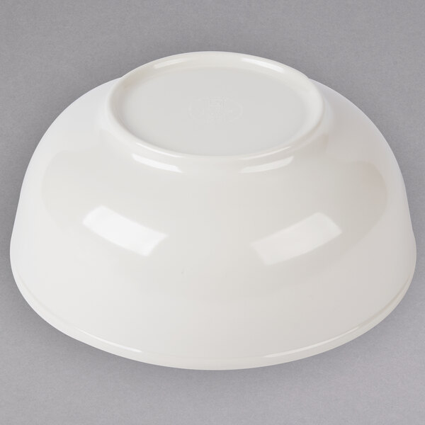 A white Thunder Group Pho noodle bowl on a gray surface.