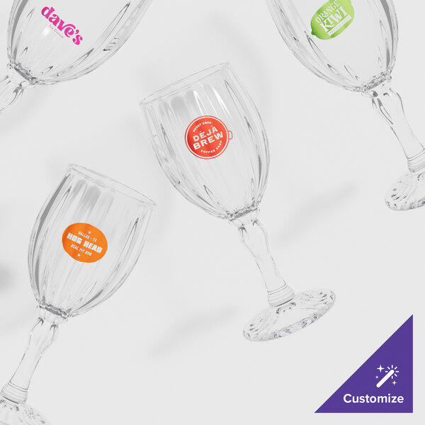 A group of customizable SAN plastic fluted wine glasses.