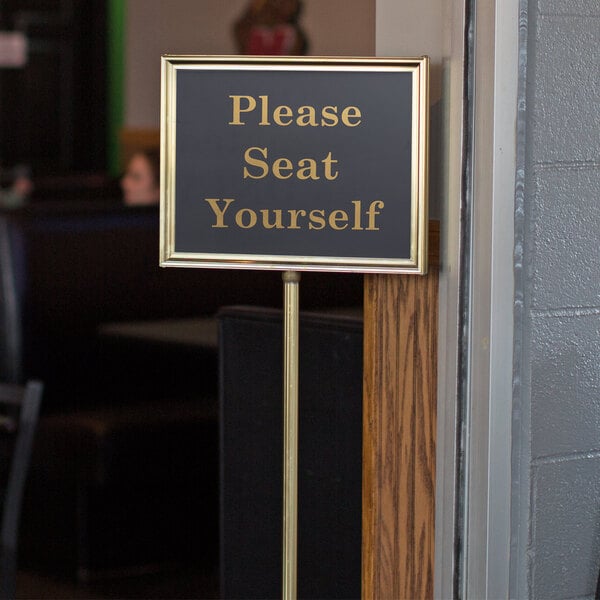 A Chef Master gold hostess sign on a pole with 13 changeable messages.