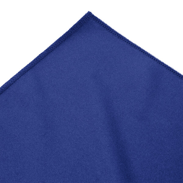 A royal blue Snap Drape Wyndham table skirt with a pleated edge.