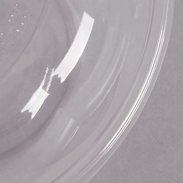 A clear compostable plastic salad bowl with a lid on top.